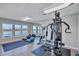 Fitness center with equipment and water views at 9393 Midnight Pass Rd # 704, Sarasota, FL 34242