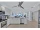 Modern kitchen with stainless steel appliances and granite countertops at 9393 Midnight Pass Rd # 704, Sarasota, FL 34242