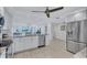 Modern kitchen with stainless steel appliances and granite countertops at 9393 Midnight Pass Rd # 704, Sarasota, FL 34242