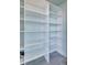 Large pantry with ample shelving for storage at 9393 Midnight Pass Rd # 704, Sarasota, FL 34242