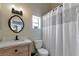 Clean bathroom with a shower/tub combo, vanity, and a window at 941 Waterside Ln, Bradenton, FL 34209