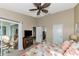 Spacious bedroom with a king-size bed and access to balcony at 941 Waterside Ln, Bradenton, FL 34209