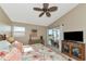 Main bedroom with a king-size bed, access to a balcony, and lots of natural light at 941 Waterside Ln, Bradenton, FL 34209