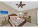 Bedroom with king-size bed and tropical decor at 941 Waterside Ln, Bradenton, FL 34209