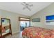 Bedroom with a full-size bed and direct access to a private patio at 941 Waterside Ln, Bradenton, FL 34209