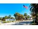 Private entrance to Perico Bay Club with an American flag at 941 Waterside Ln, Bradenton, FL 34209