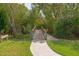 Wooden footbridge leading through lush greenery to a waterway at 941 Waterside Ln, Bradenton, FL 34209