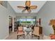 Living area with comfy seating and access to a screened balcony overlooking nature at 941 Waterside Ln, Bradenton, FL 34209