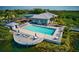 Resort-style pool with a large deck overlooking the lake at 941 Waterside Ln, Bradenton, FL 34209