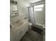 Bright bathroom featuring a tub shower, vanity with drawers, and new flooring at 970 S Allendale Ave, Sarasota, FL 34237