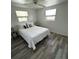 Bright bedroom featuring a comfortable bed and wood-look floors at 970 S Allendale Ave, Sarasota, FL 34237