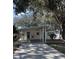 Cute bungalow with carport, hammock, and mature landscaping at 970 S Allendale Ave, Sarasota, FL 34237