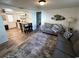 Living room with gray couch and large area rug at 970 S Allendale Ave, Sarasota, FL 34237