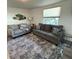 Comfortable living room with gray sofas and accent pillows at 970 S Allendale Ave, Sarasota, FL 34237