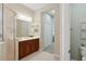 Bathroom with double vanity, large mirror, and shower at 12204 Thornhill Ct, Lakewood Ranch, FL 34202