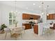 Modern kitchen with wood cabinets and island at 12204 Thornhill Ct, Lakewood Ranch, FL 34202