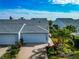 Aerial view of a waterfront home with two-car garage at 1229 Spoonbill Landings Cir, Bradenton, FL 34209