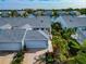 Aerial view of a waterfront home with two-car garage at 1229 Spoonbill Landings Cir, Bradenton, FL 34209