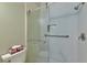 Shower with sliding glass door and marble tile at 1229 Spoonbill Landings Cir, Bradenton, FL 34209