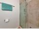 Shower with glass enclosure and marble tile at 1229 Spoonbill Landings Cir, Bradenton, FL 34209