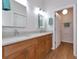 Double vanity bathroom with light wood cabinets at 1229 Spoonbill Landings Cir, Bradenton, FL 34209