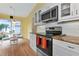 Modern kitchen with stainless steel appliances and granite countertops at 1229 Spoonbill Landings Cir, Bradenton, FL 34209