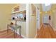 Bright kitchen with breakfast bar open to entry and hardwood floors at 1229 Spoonbill Landings Cir, Bradenton, FL 34209