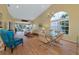 Living room with vaulted ceiling, comfy seating and water view at 1229 Spoonbill Landings Cir, Bradenton, FL 34209
