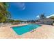 Relaxing community pool area with patio furniture and tranquil waterfront view at 1229 Spoonbill Landings Cir, Bradenton, FL 34209