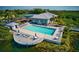 Community pool with sundeck and lounge chairs at 1229 Spoonbill Landings Cir, Bradenton, FL 34209