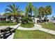 Community grilling area with picnic table and lush landscaping at 1243 Siesta Bayside Dr # D, Sarasota, FL 34242