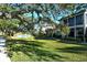 Private screened patio with pond view and lush landscaping at 1243 Siesta Bayside Dr # D, Sarasota, FL 34242