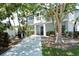 Community grilling area with walkway and lush landscaping at 1243 Siesta Bayside Dr # D, Sarasota, FL 34242