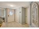 Front entry with coat closet and decorative mirror at 1243 Siesta Bayside Dr # D, Sarasota, FL 34242