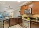 Modern kitchen with granite countertops and stainless steel appliances at 1243 Siesta Bayside Dr # D, Sarasota, FL 34242