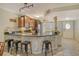 L-shaped kitchen with granite countertops and stainless steel appliances at 1243 Siesta Bayside Dr # D, Sarasota, FL 34242