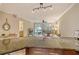 Kitchen with granite countertops, view of living room at 1243 Siesta Bayside Dr # D, Sarasota, FL 34242