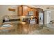 Modern kitchen with granite countertops and breakfast bar at 1243 Siesta Bayside Dr # D, Sarasota, FL 34242
