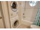 Stackable washer and dryer in the bathroom area at 1243 Siesta Bayside Dr # D, Sarasota, FL 34242