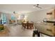 Open living room and kitchen with a cozy seating area and dining table at 1243 Siesta Bayside Dr # D, Sarasota, FL 34242