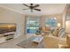 Living room with comfortable sofas and sliding glass doors leading to the patio at 1243 Siesta Bayside Dr # D, Sarasota, FL 34242