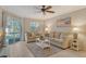 Living room with comfortable sofas and sliding glass doors leading to the patio at 1243 Siesta Bayside Dr # D, Sarasota, FL 34242