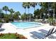 Refreshing community pool with lounge chairs and landscaping at 1243 Siesta Bayside Dr # D, Sarasota, FL 34242