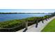 Scenic waterfront walkway with lush greenery at 1243 Siesta Bayside Dr # D, Sarasota, FL 34242