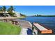 Tranquil waterfront view with private dock and seating at 1243 Siesta Bayside Dr # D, Sarasota, FL 34242