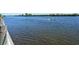 Peaceful waterway view with boat passing by at 1243 Siesta Bayside Dr # D, Sarasota, FL 34242