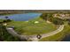 Golf course putting green with players and golf carts at 12826 Del Corso Loop, Bradenton, FL 34211