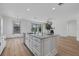 Spacious kitchen island with granite countertop and white cabinets at 12826 Del Corso Loop, Bradenton, FL 34211