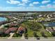 Aerial view of a residential community with lakes and well-maintained landscaping at 13408 Swiftwater Way, Bradenton, FL 34211