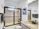 Bathroom with a granite vanity and a shower with glass door at 13408 Swiftwater Way, Bradenton, FL 34211